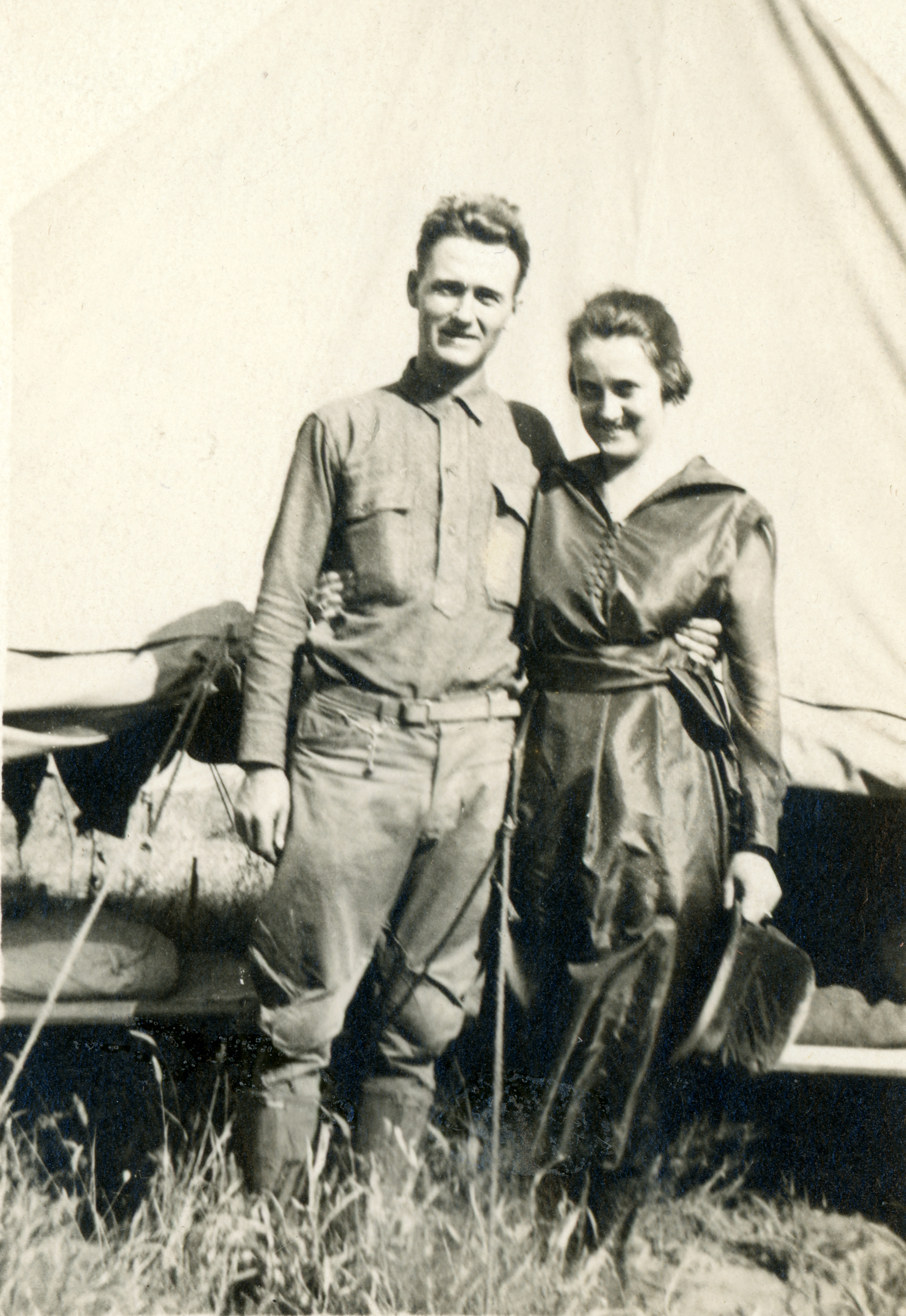 Jo with Tom in front of his tent at Camp Funston.
